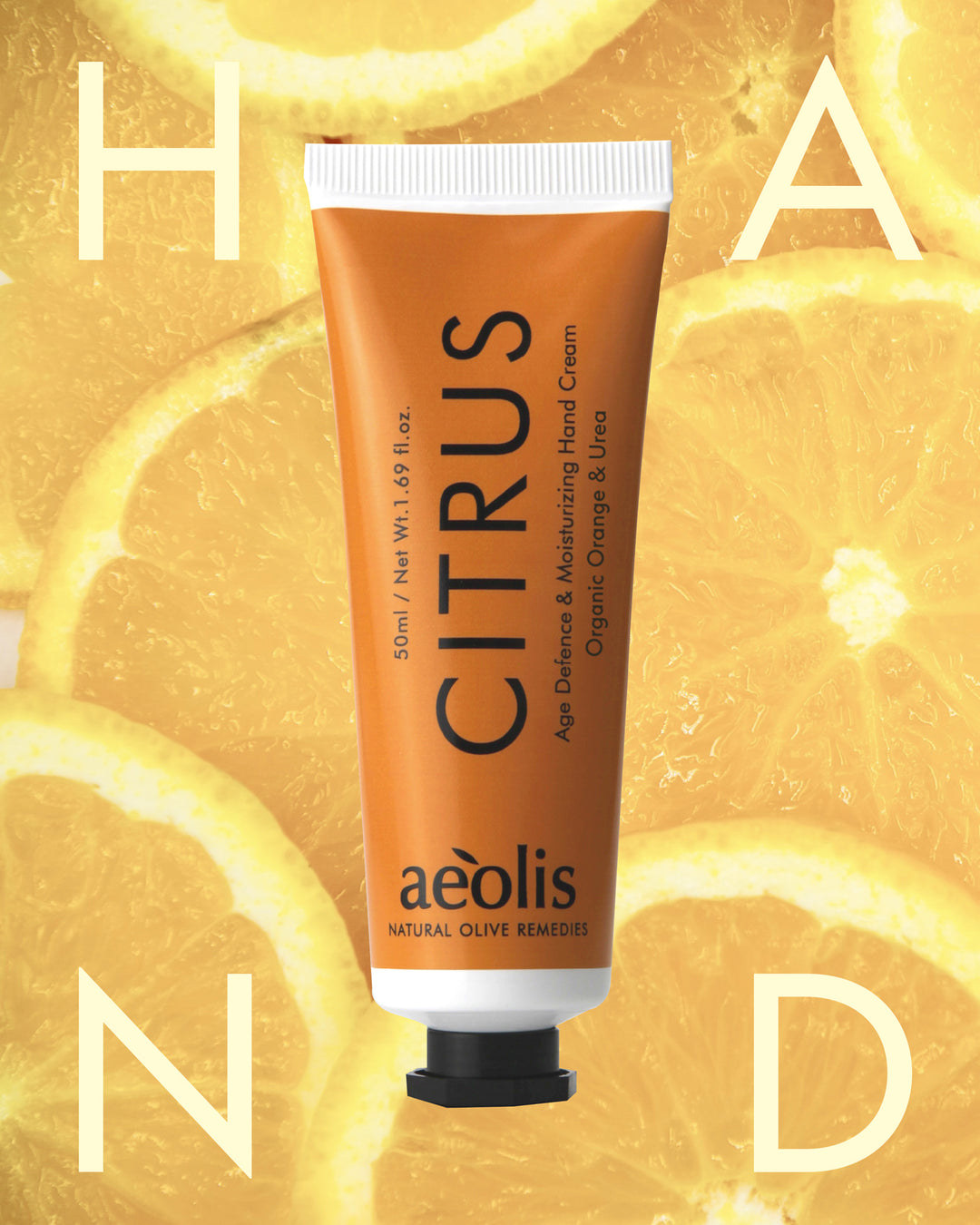Tube of Aeolis Citrus hand cream on a yellow background with orange slices.