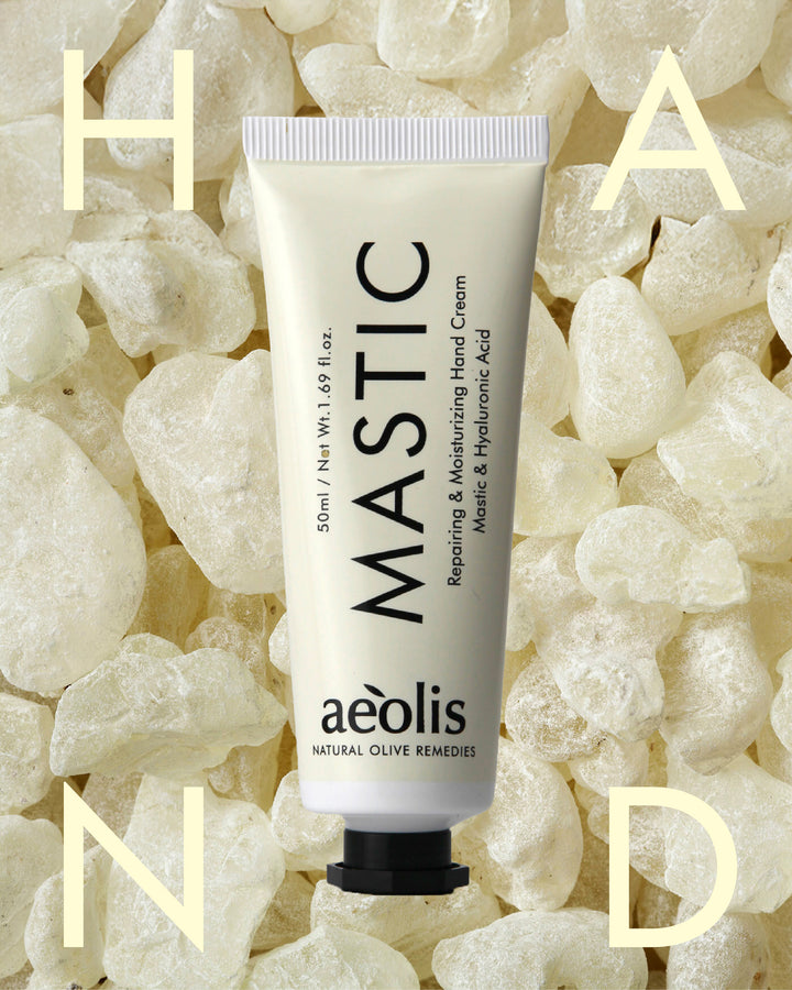 Aeolis Mastic hand cream tube on a textured beige background
