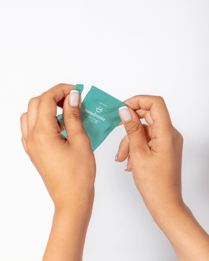 Hands holding a mask packet