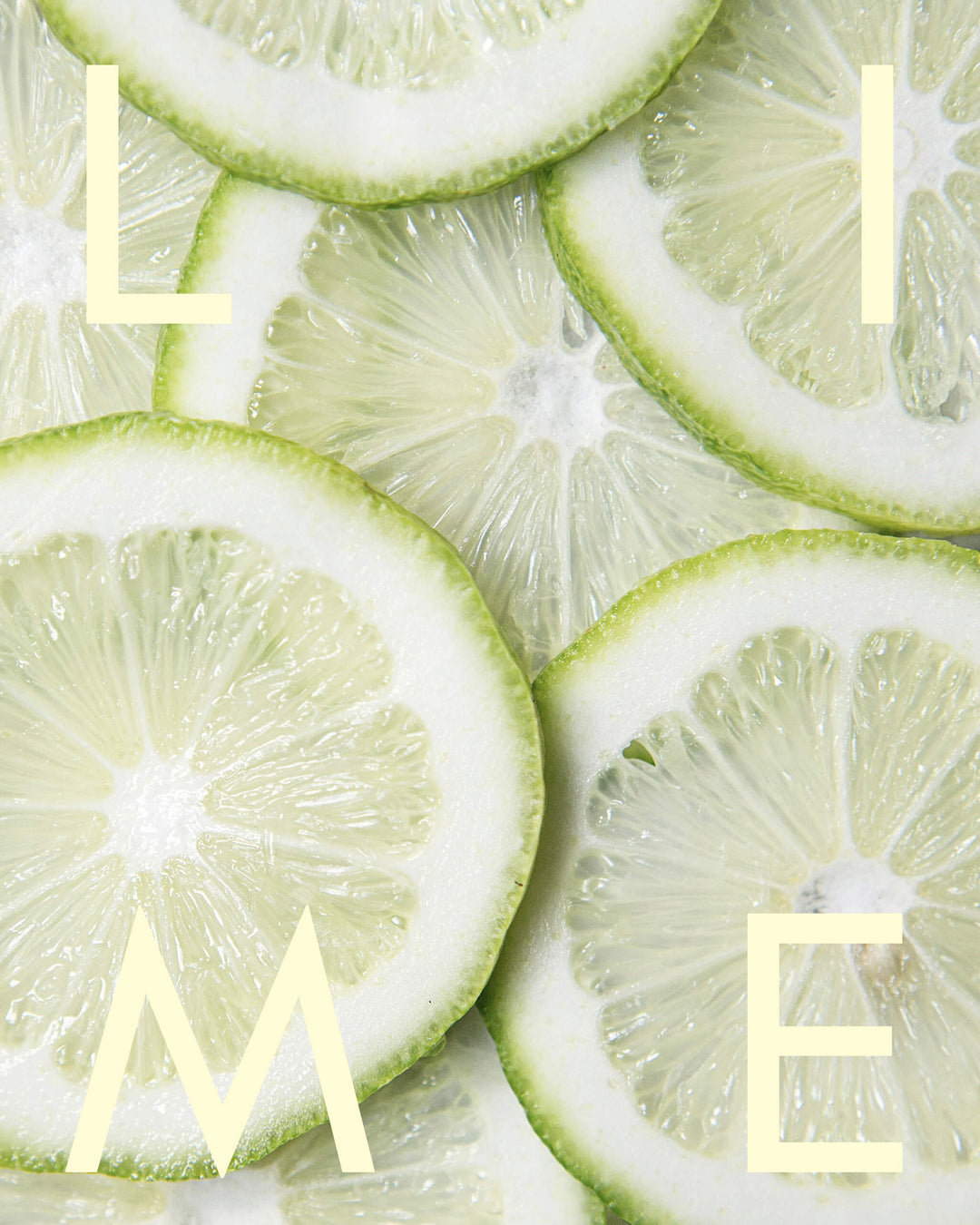 Close-up of sliced limes with the word &