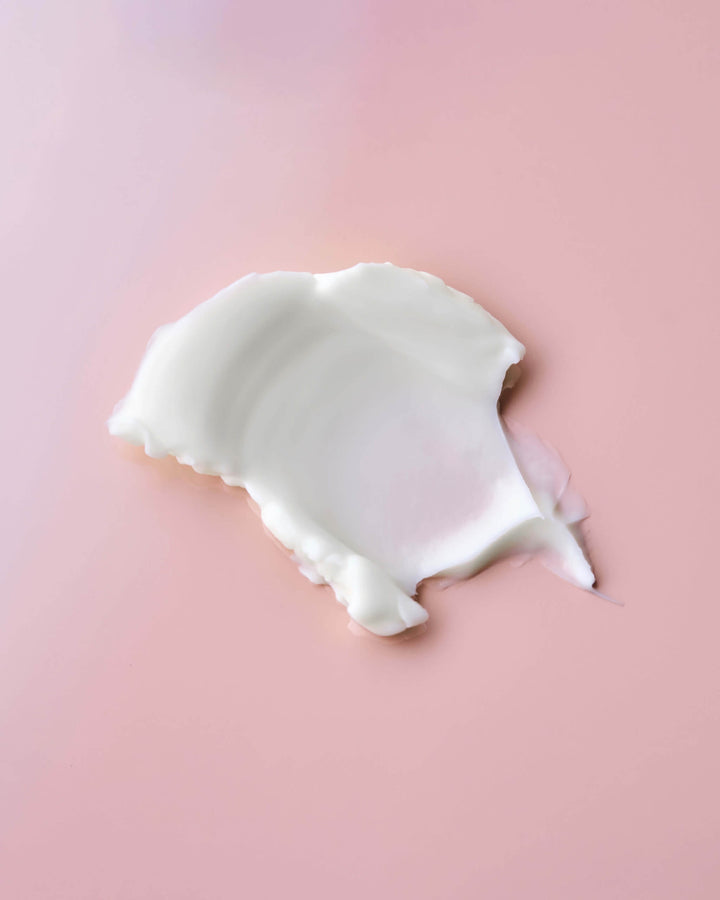 White swatch on a pink background
