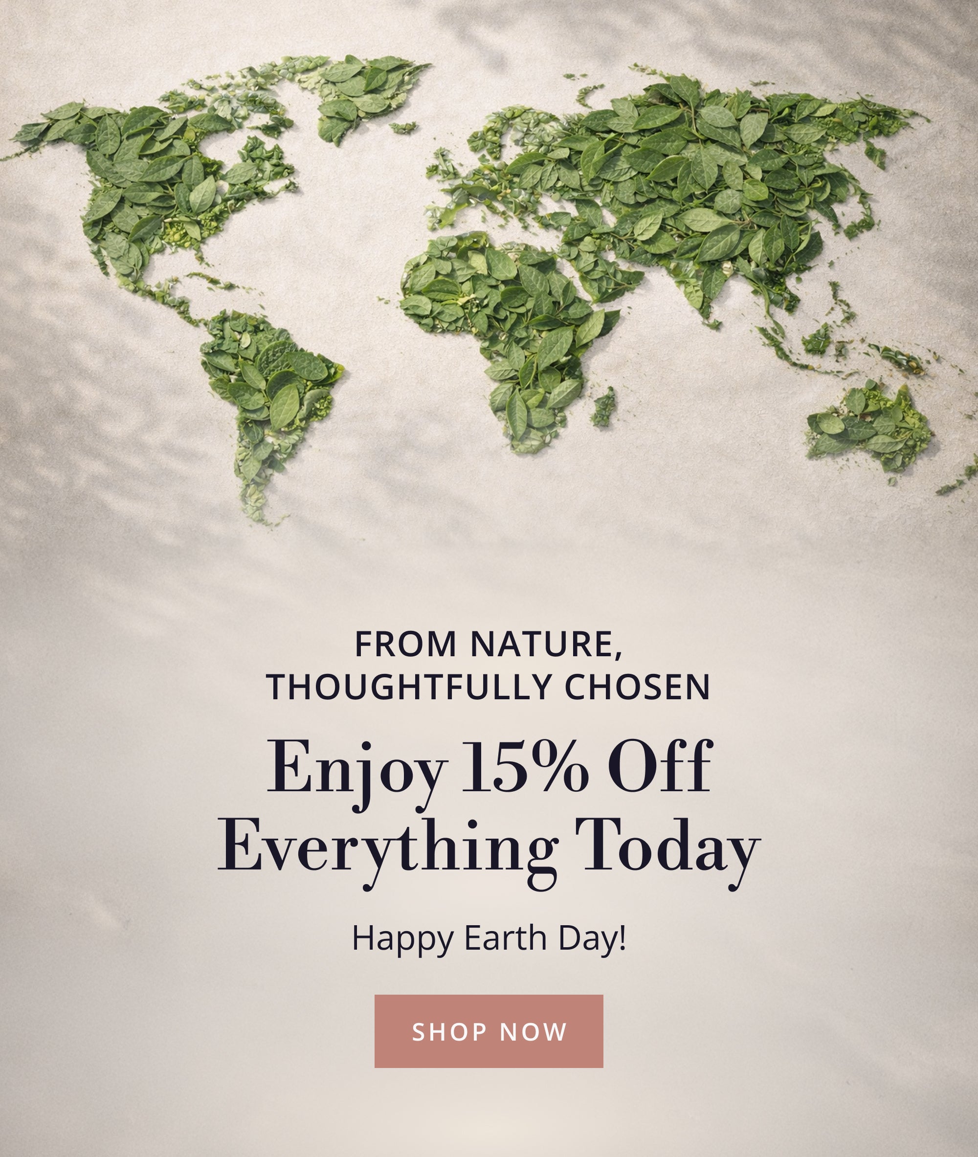 World map made of green leaves with promotional text for 15% Off Sitewide for Earth Day Sale. 