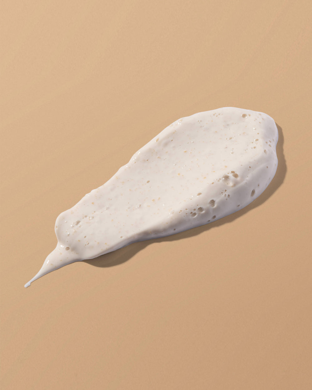 White mask smear on a beige background